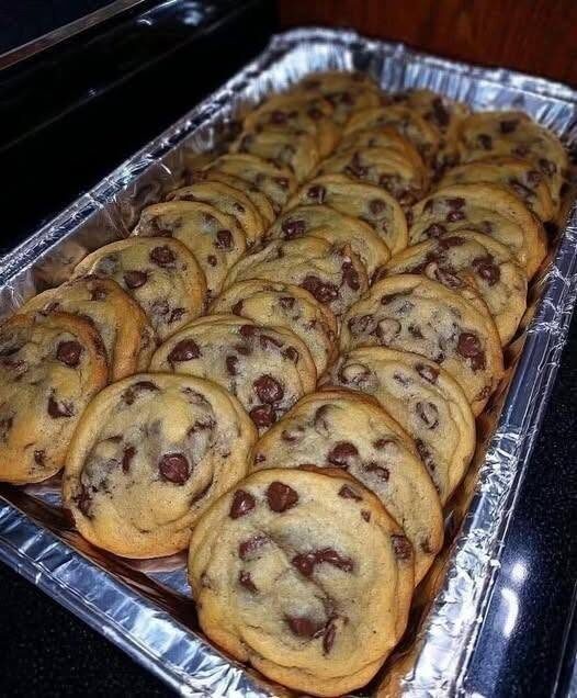 Here is a classic, bakery-style recipe to recreate these golden, soft-chewy chocolate chip cookies.